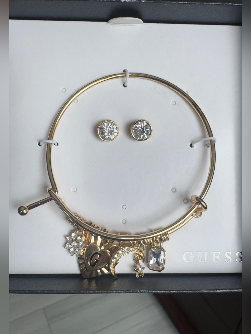 Guess Gold-Tone Charm Bangle Bracelet with Clear Crystal Studs - Picture 2 of 3